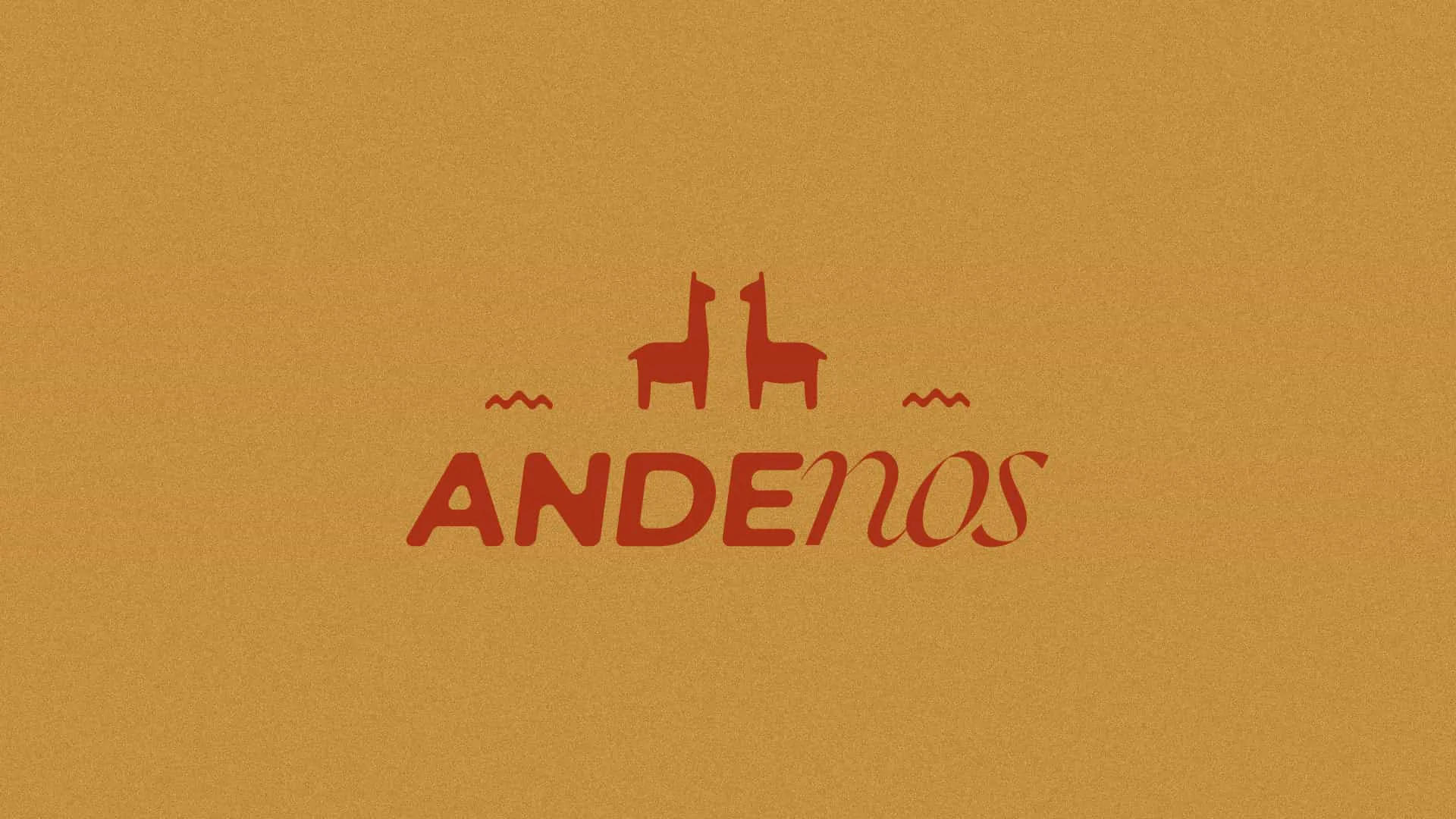 Le logotype « Andenos » en rouge sur fond ocre, surmonté de deux lamas face à face et de deux petites vagues.